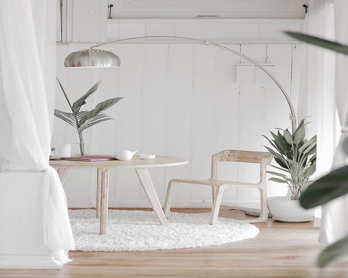 Bright living room with sheer curtains diffusing strong sunlight